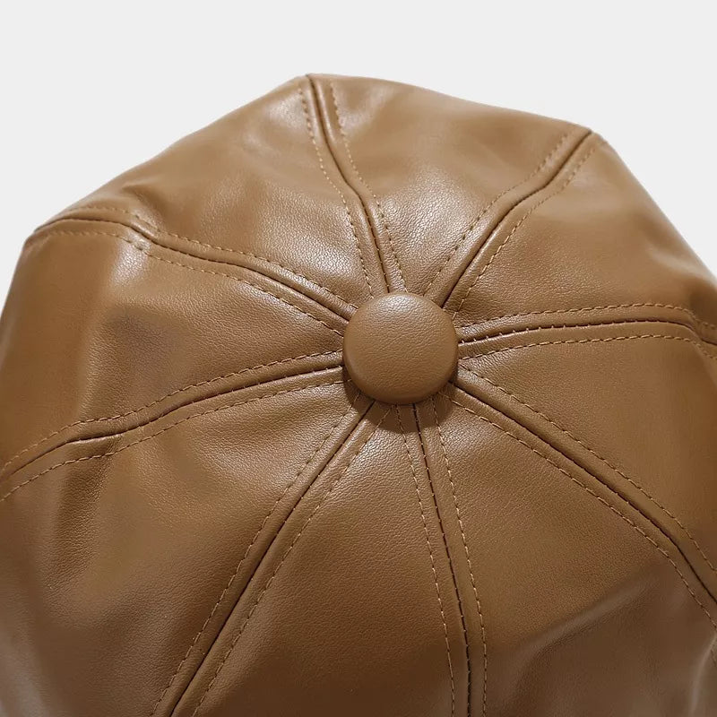 dark brown hat with stiff brim and none