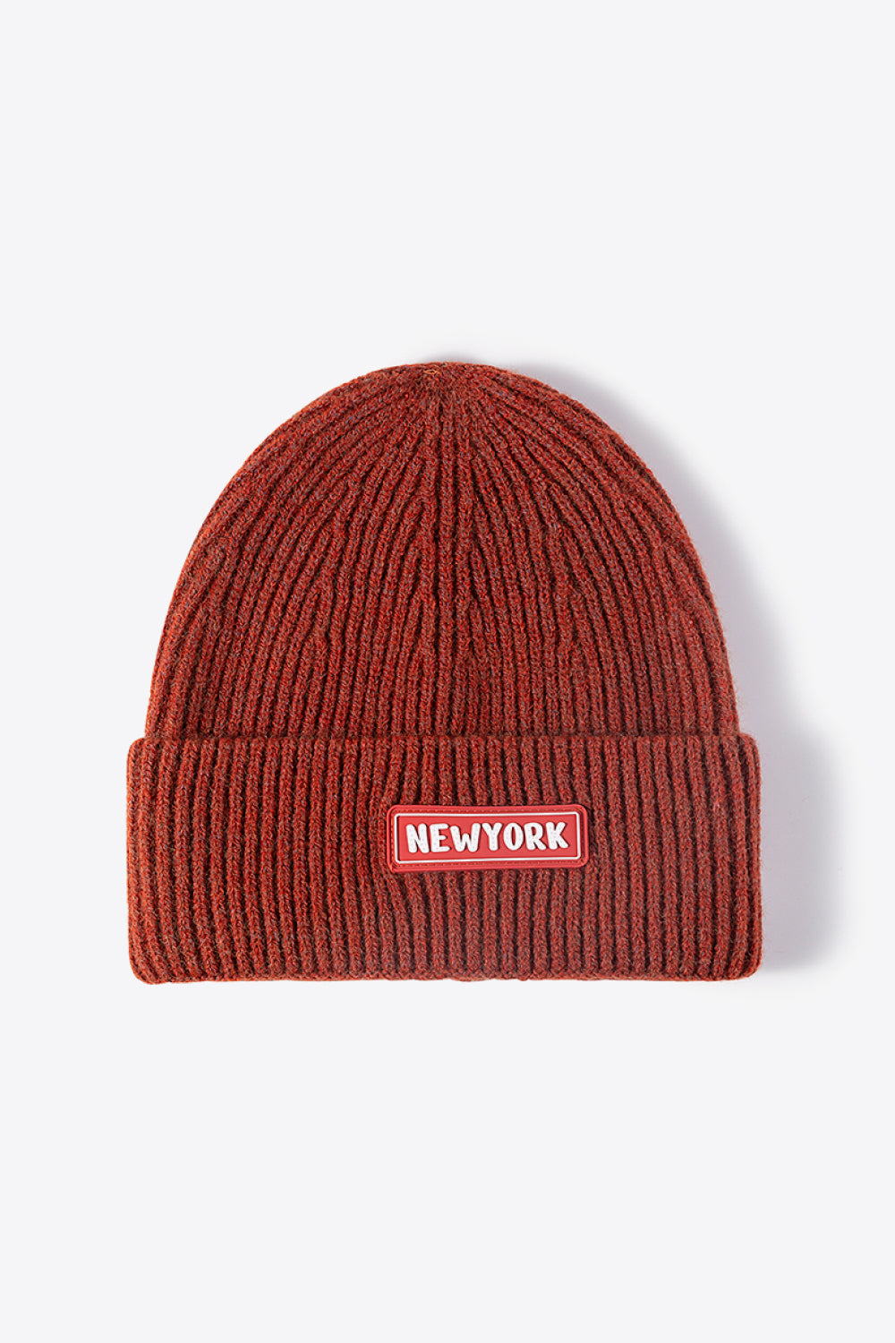 Rust ribbed acrylic beanie with New York patch