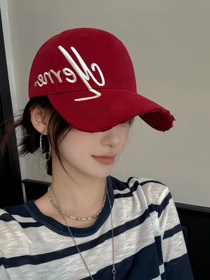 Wine red cotton baseball cap with distressed brim and white embroidery