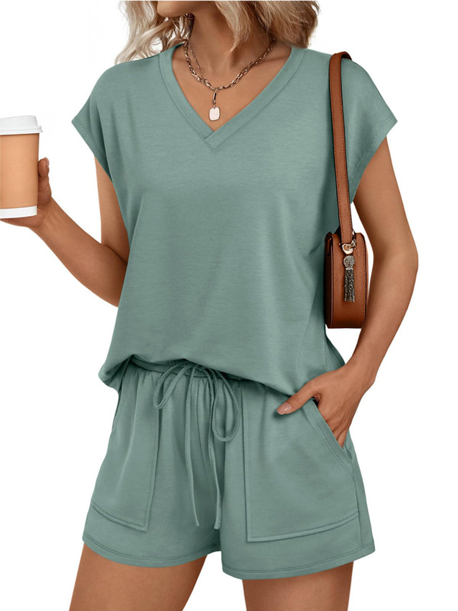 Light green V-neck top and drawstring shorts set with pockets.