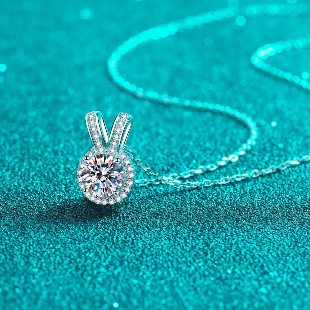 Silver halo diamond pendant necklace with rabbit ear detail on 925 sterling silver chain.