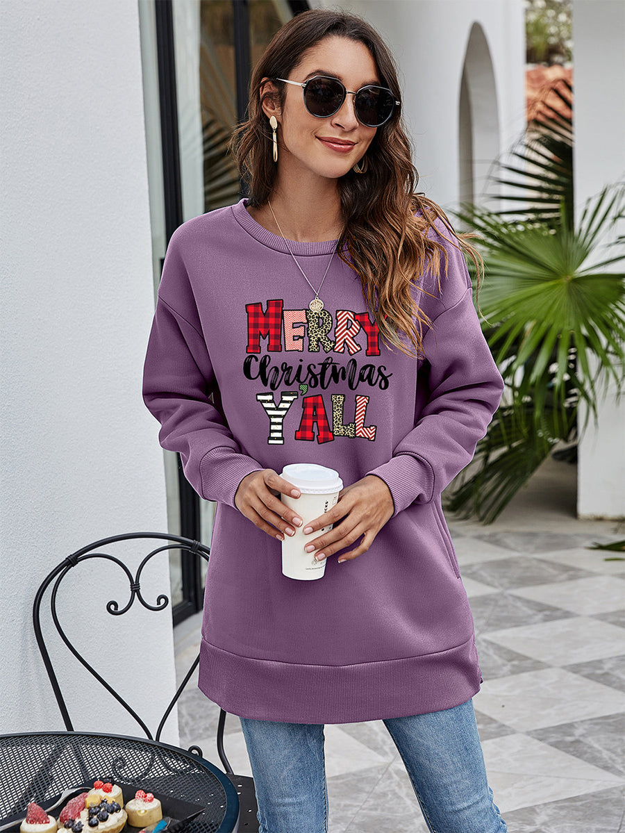 Oversized purple sweatshirt with Merry Christmas Y'all graphic in plaid and animal print.