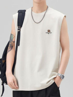 Men's oversized ivory cotton tank top with chest graphic and crew neck.