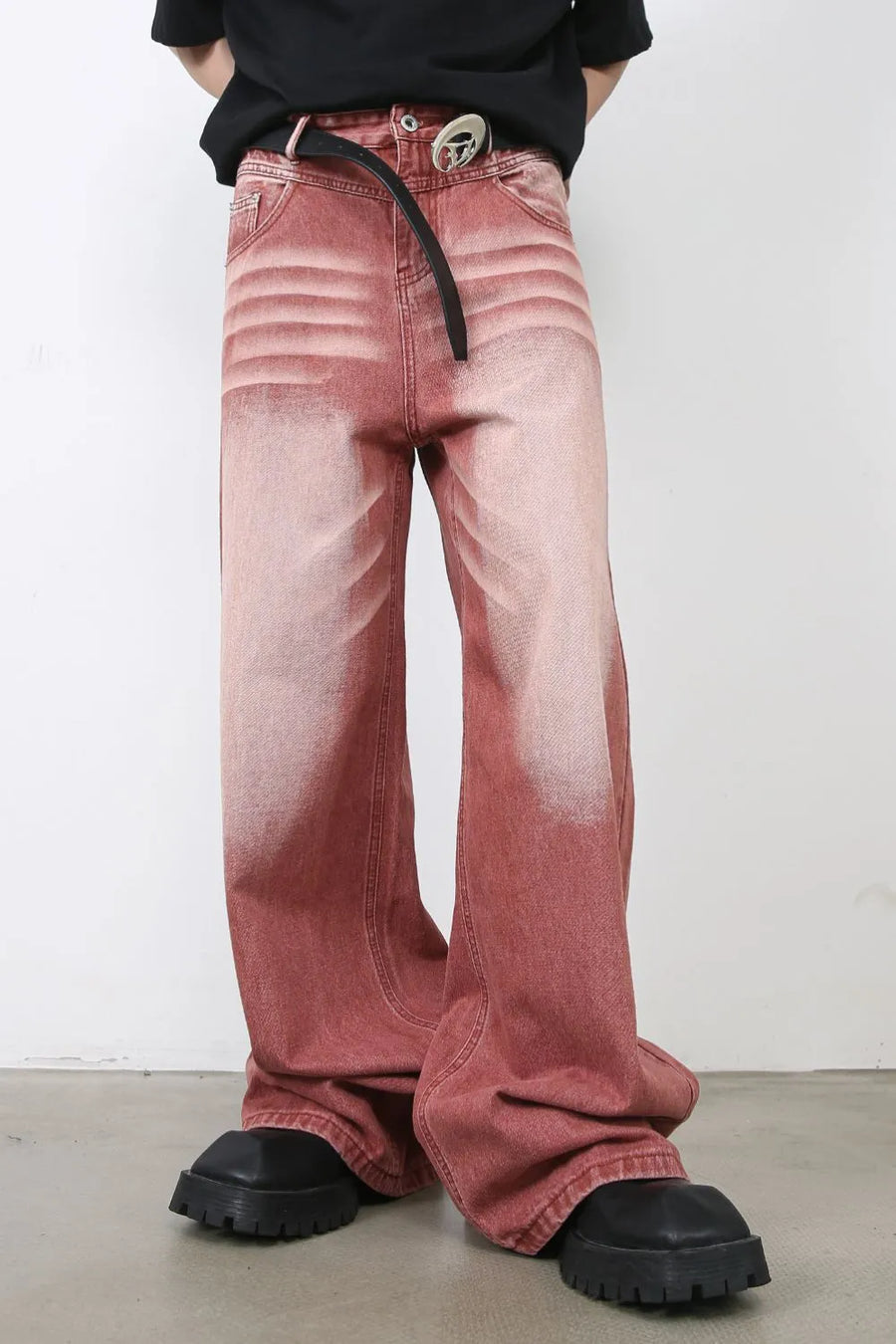 Dip-dye wide-leg denim trousers in rust with a faded effect and textured waistband detail.