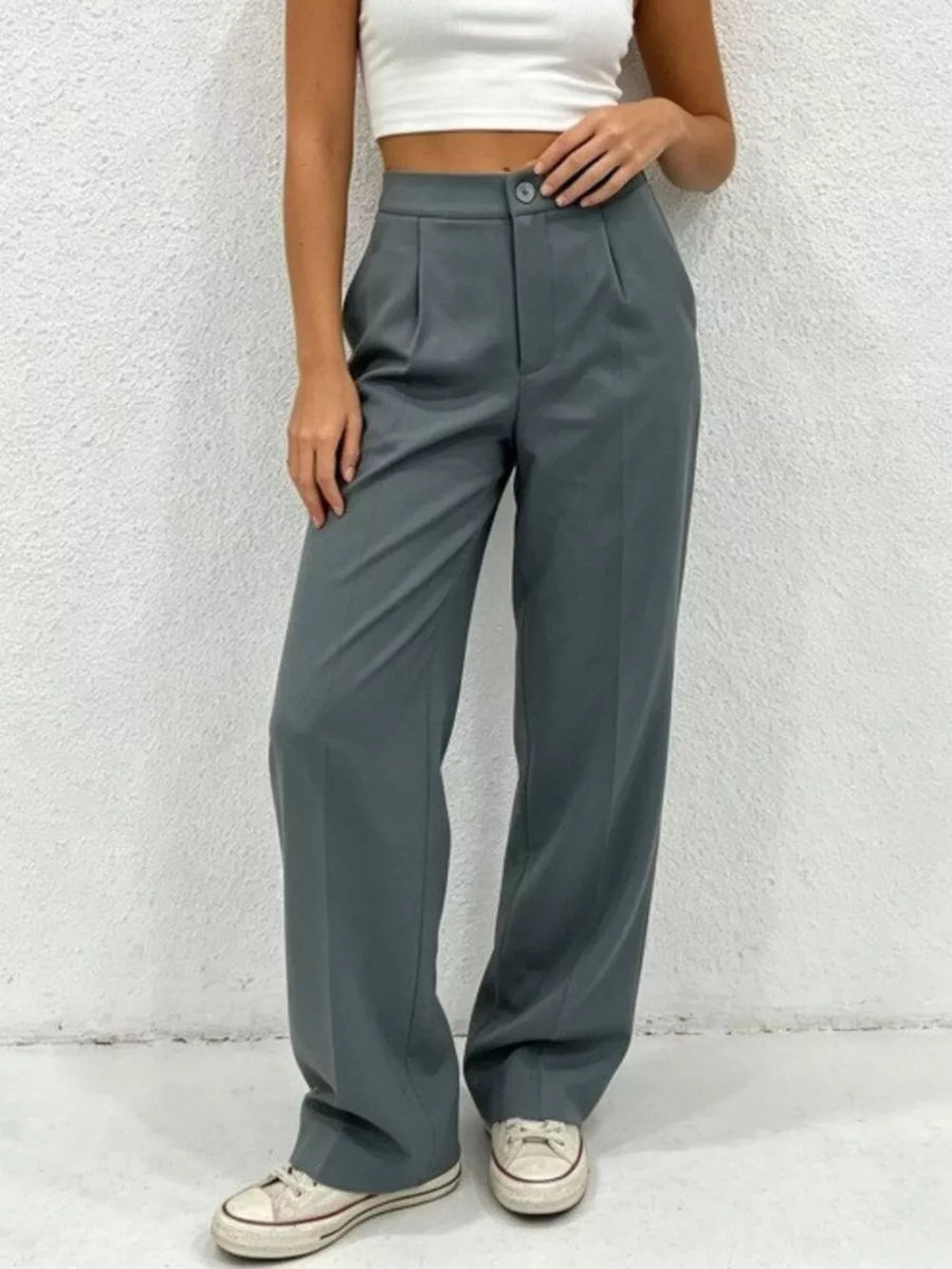 Chic high-waisted pleated maternity pants in grey, featuring a button closure and wide leg.