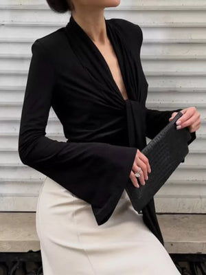 blouse in black featuring tied and fitted fit