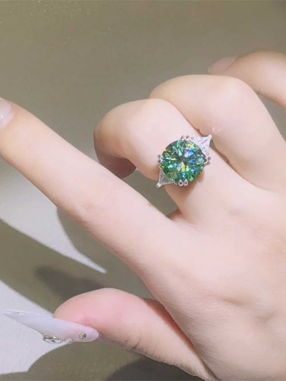 Emerald Prism Silver Ring with turquoise stone and accent stones on a hand.