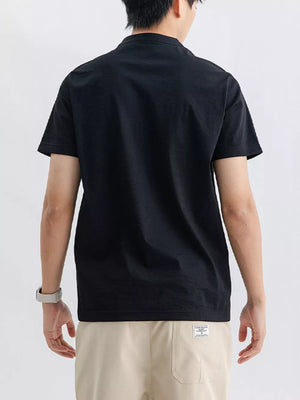 Men's black cotton short sleeve t-shirt with a band collar, shown from the back.