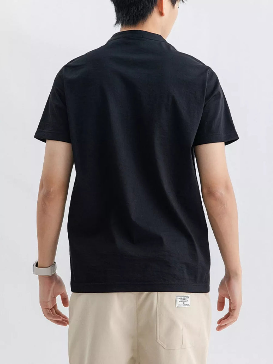 Men's black cotton short sleeve t-shirt with a band collar, shown from the back.