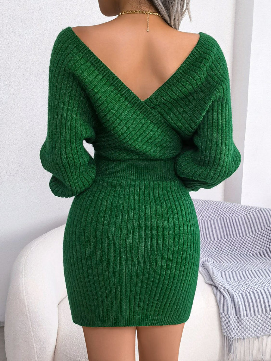 Green wrap knit bodycon mini dress with V-neck and long sleeves.