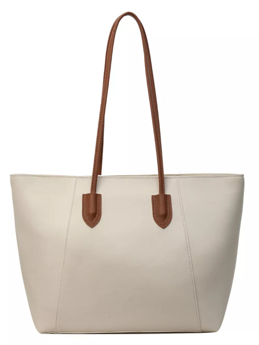 Chic structured white PU leather tote bag with brown handles and clean silhouette.