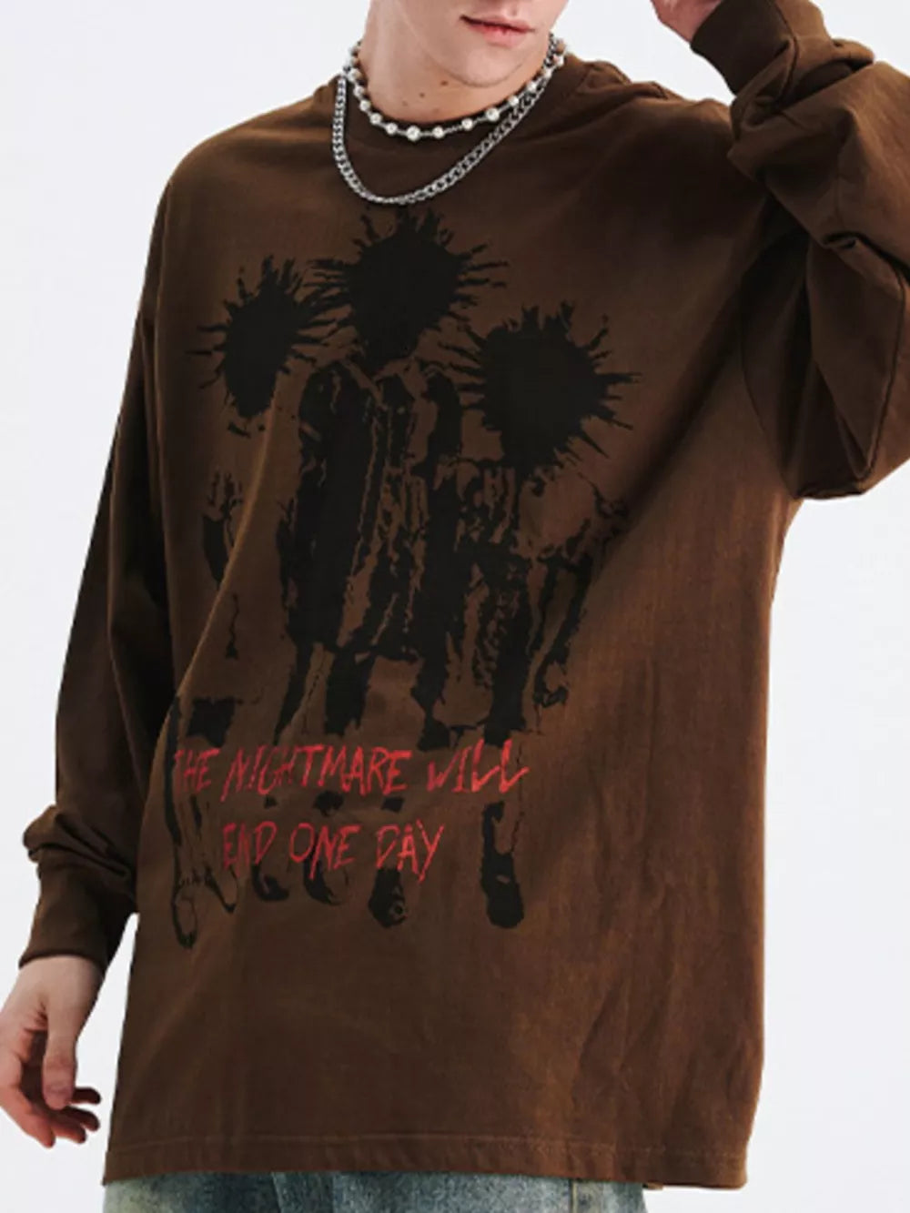Brown oversized long sleeve cotton t-shirt with a graphic print and red text.