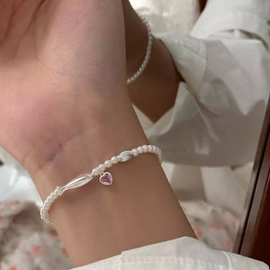 Synthetic Pearl,925 sterling silver,Artificial crystal Care instructions: Avoid bracelet in pink with regular silhouette