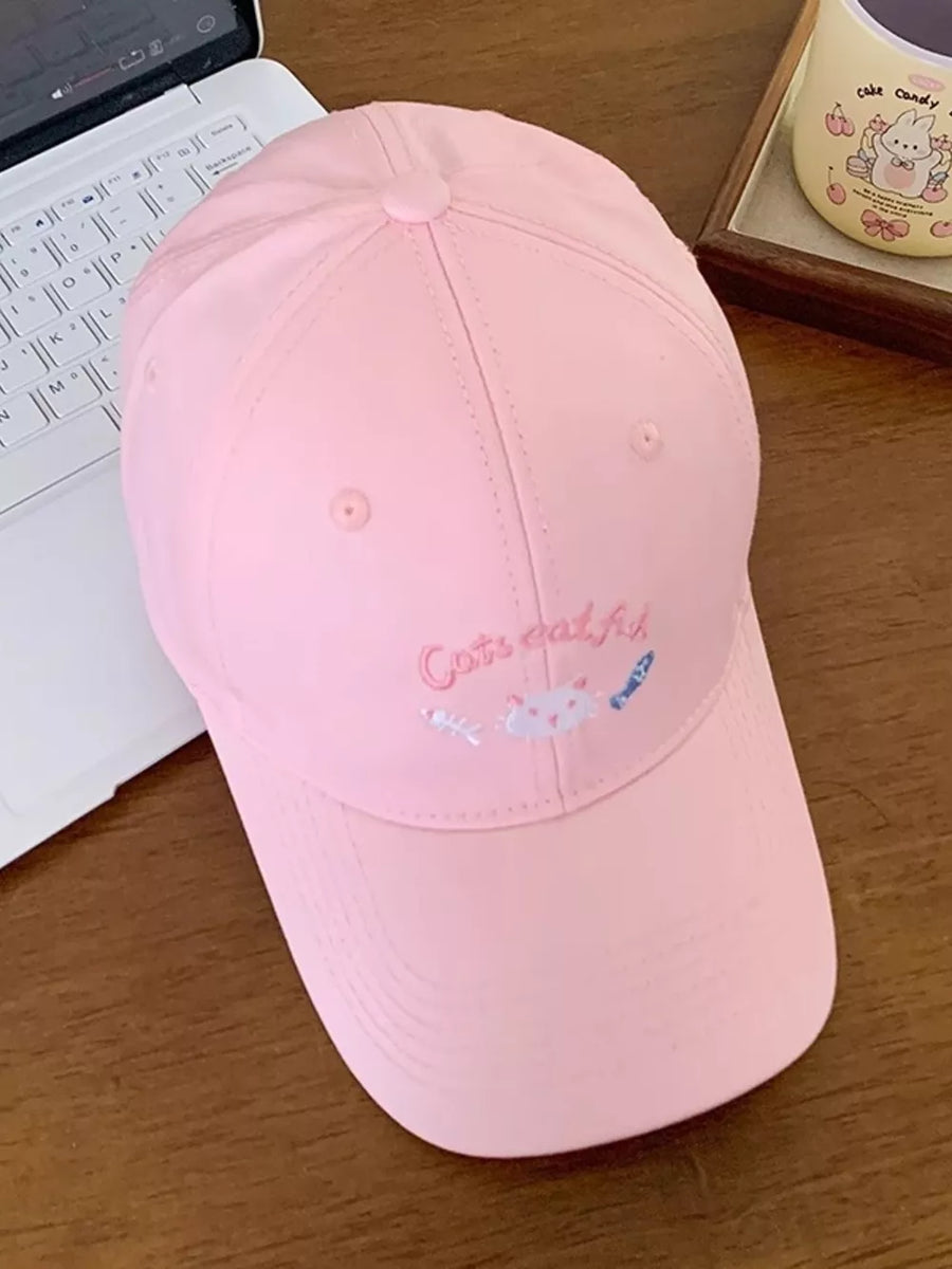 Pink baseball cap with embroidered cats and fish detail