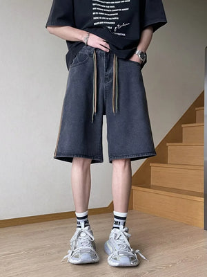 Men's black wide-leg denim shorts with drawstring and side stripe detail