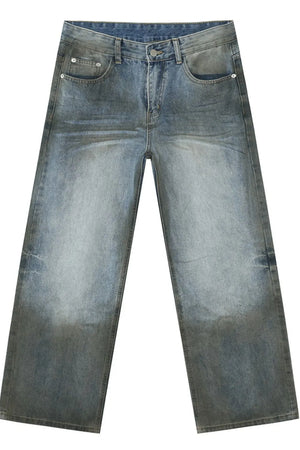 Pocketed high rise slouchy denim jeans in a faded medium wash with a relaxed fit.