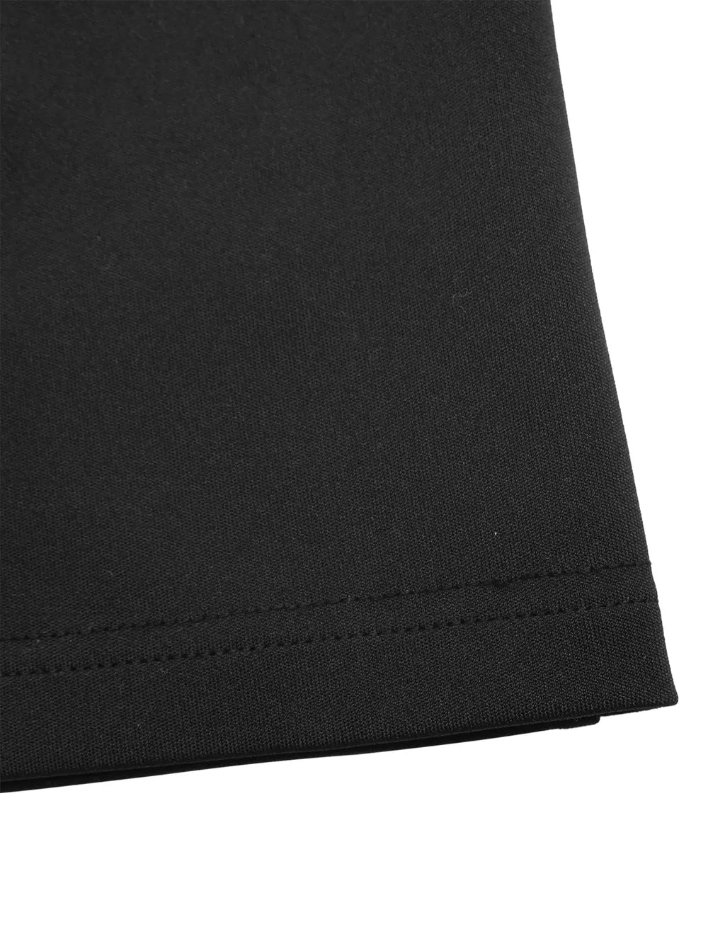Black maternity romper detail showing hem stitching and fabric texture.