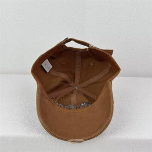 Brown baseball cap with embroidered text and distressed brim detail.