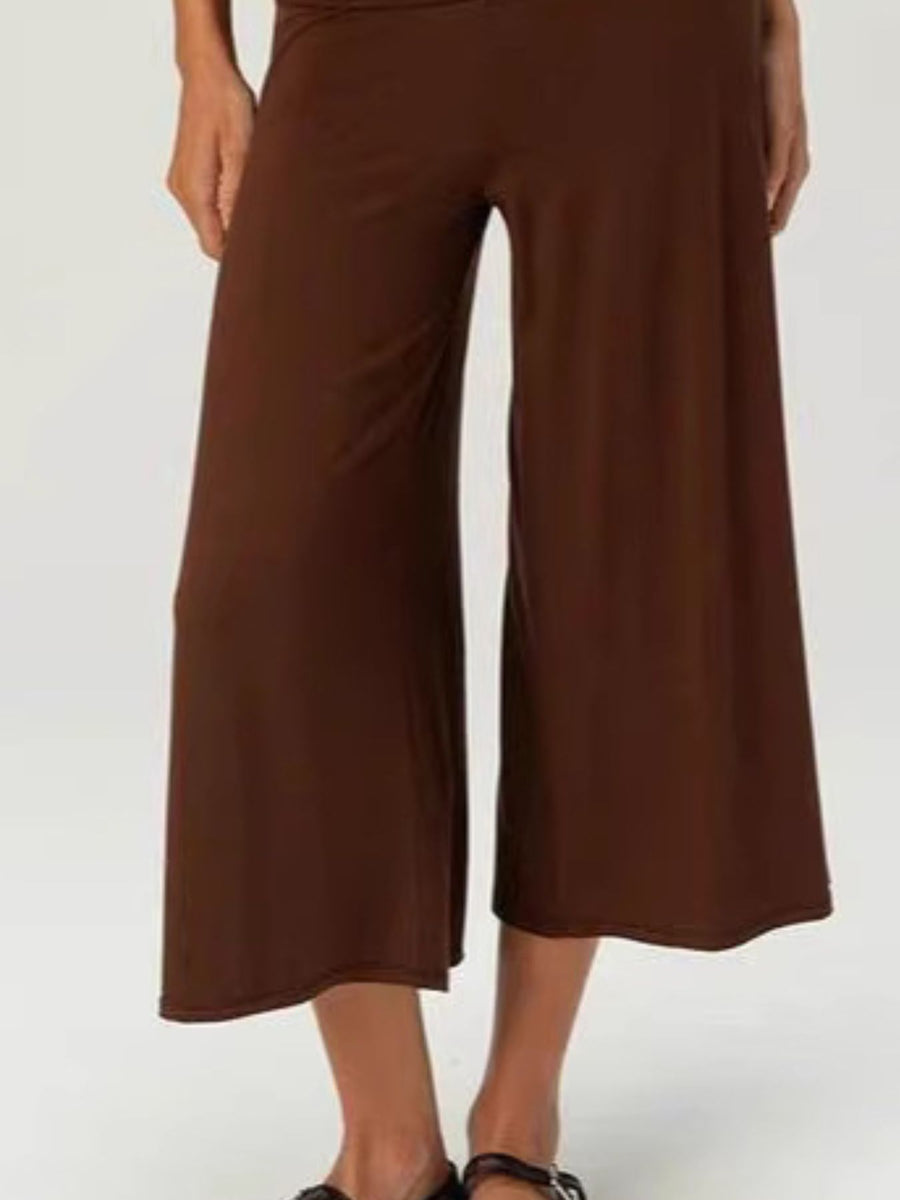 Brown relaxed wide leg capris with a comfortable fit and flowy silhouette.
