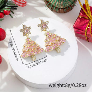 Festive Holiday Tree Earrings in blush pink with star tops, adorned with shimmering rhinestones.