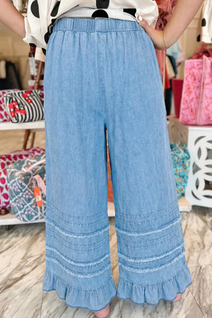 Light blue denim wide leg cropped pants with tiered ruffled hem and elastic waist
