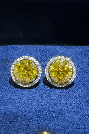Gold halo stud earrings with canary yellow moissanite and diamond accents.