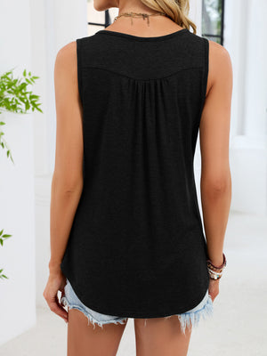 Black ruched tank top with button detail and curved hem, worn with denim shorts.