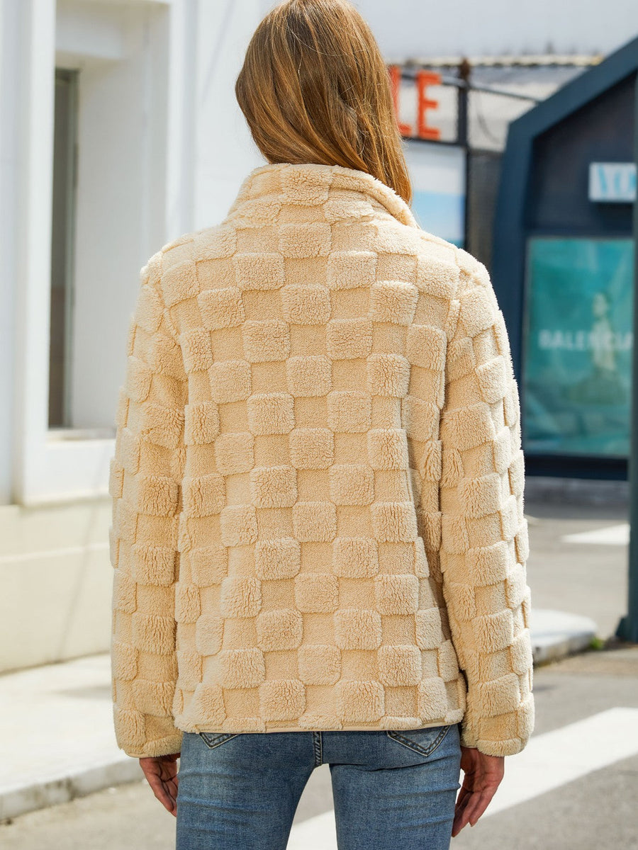 Tan textured grid zip-up jacket with a stand-up collar.