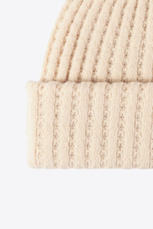 Beige ribbed knit beanie with textured detail