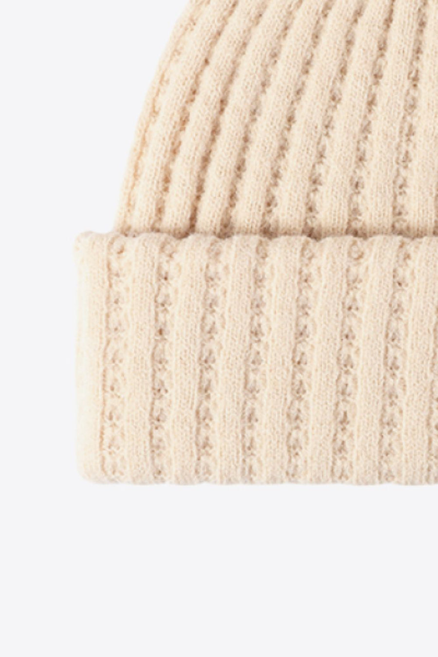 Beige ribbed knit beanie with textured detail