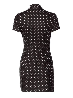 Black polka dot mini dress with short sleeves and a mock neck.