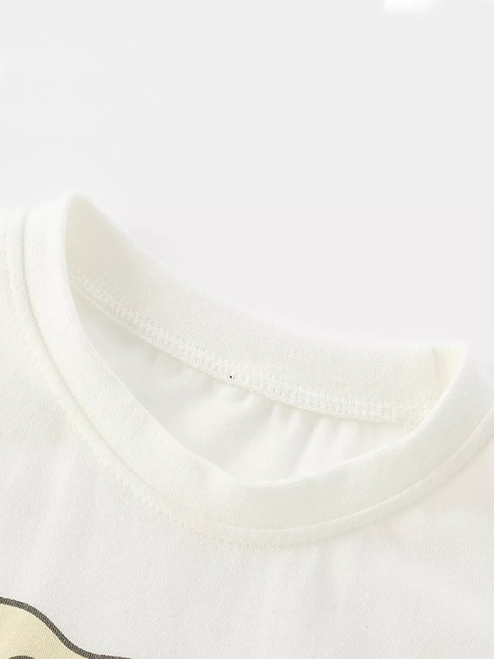 White cotton toddler t-shirt with elephant graphic detail and ribbed neckline.