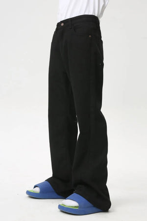 Black wide-leg denim trousers with a casual fit, shown from the side.