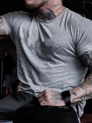 Gray crew neck t-shirt with short sleeves and a muscle fit.