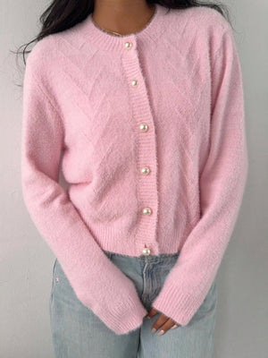 Pink cardigan featuring buttoned and chevron