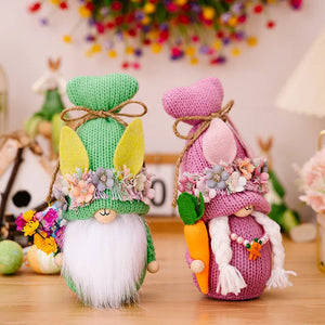 Easter gnome knit companions in green and pink with bunny ears and floral wreaths.