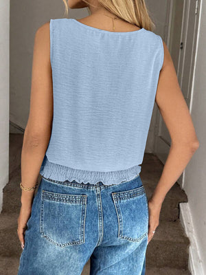 Light blue smocked waist relaxed fit tank top with a scoop neck.