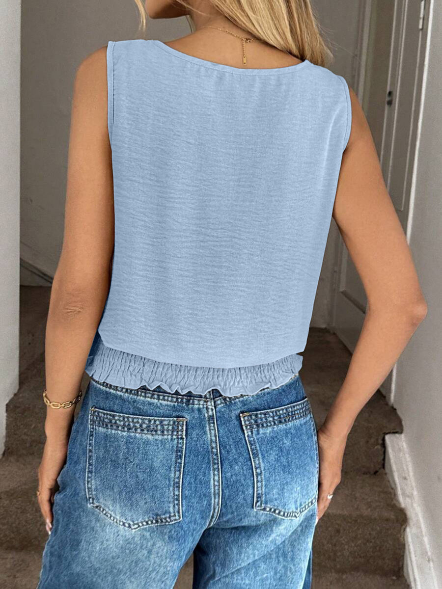 Light blue smocked waist relaxed fit tank top with a scoop neck.