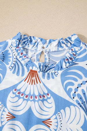 Blue and white botanic print dress with ruffled neckline and keyhole back detail.