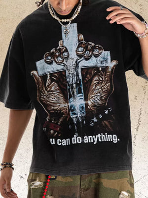 Black graphic t-shirt with acid wash, crew neck, and a Jesus on cross print.