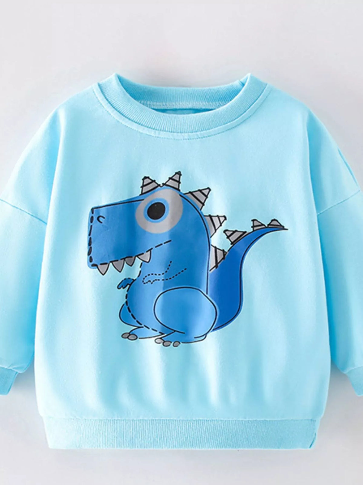 Pastel blue crew neck sweatshirt with a blue dinosaur graphic print.