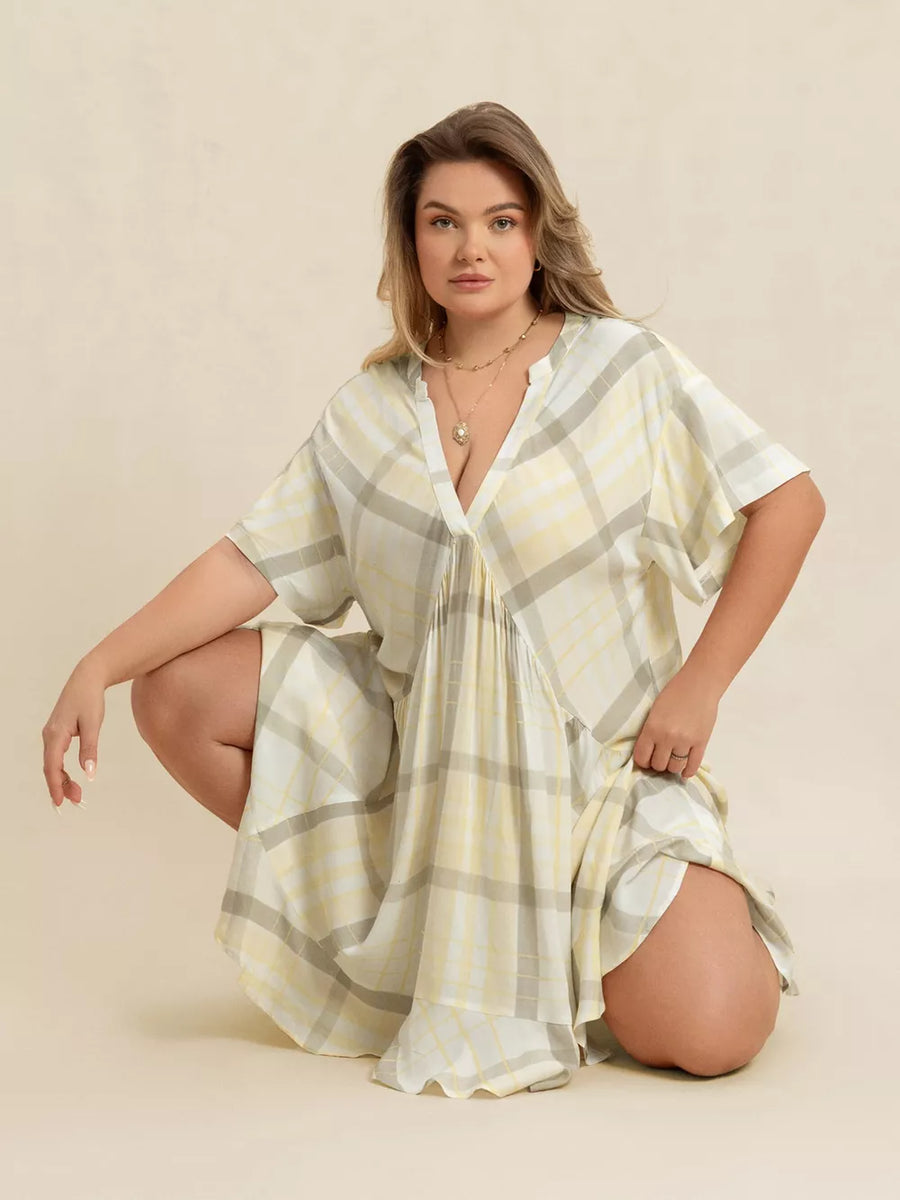 Plus size beige plaid flutter sleeve midi dress with V-neck and cinched waist