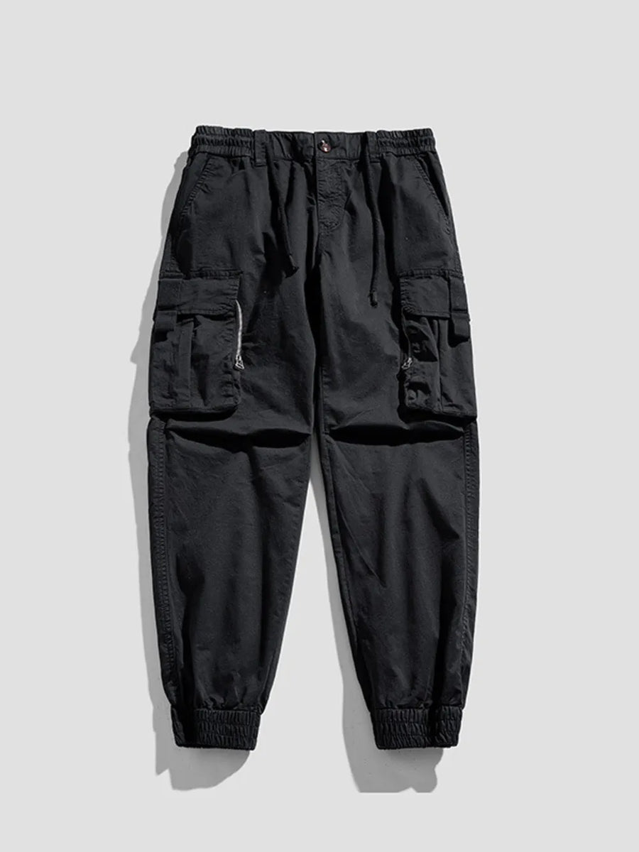 Black cargo joggers with flap pockets and elastic cuffs.