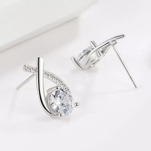 925 sterling silver,Moissanite Carat weight: 1ct Care instructions: Avoid wearin earrings in Silver with abstract silhouette