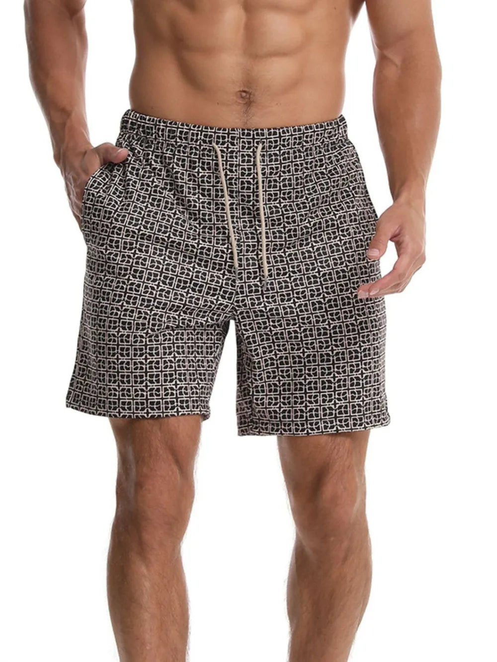 Geometric print boardshorts in black with drawstring waist and side pockets.