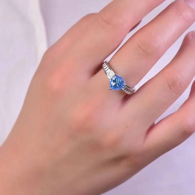 Silver ring with heart-cut aquamarine and baguette accents