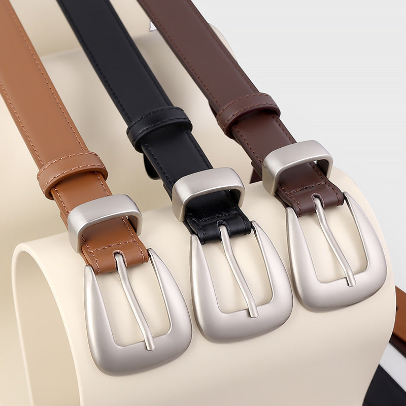 Sleek cowhide leather belts in coffee brown, black, and brown with silver buckles.