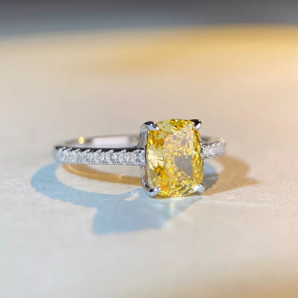 silver ring featuring center stone and geometric