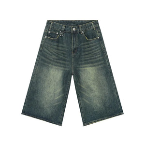 Wide-leg denim culottes in a distressed blue wash with a relaxed fit.