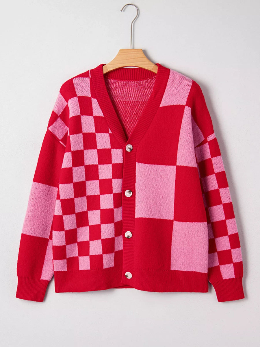 Checkerboard knit cardigan in red and pink with button front and V-neck.